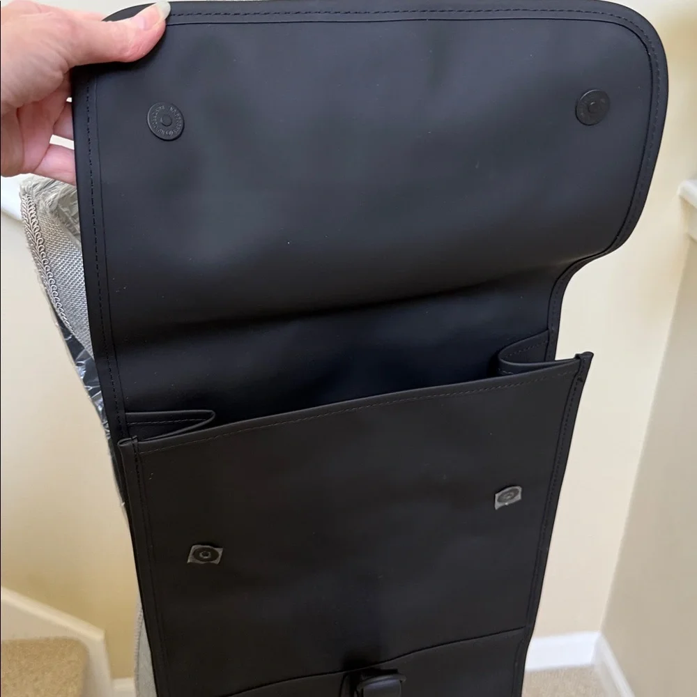 Rains Black Backpack. Clean and ever contemporary.